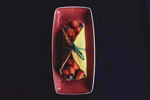 dish taco on maroon ceramic tray meal