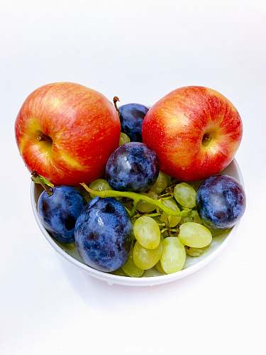 plant three assorted fruits in bowl apple