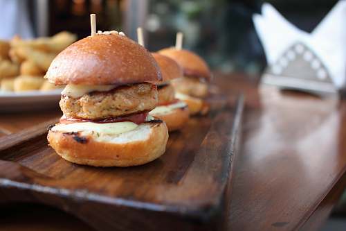 sandwich three burgers on wooden table burger