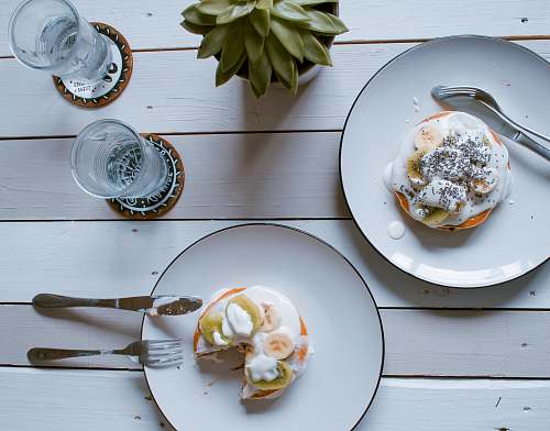 cutlery two donuts on plate spoon