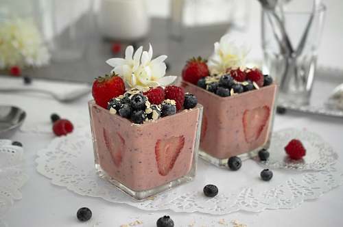 fruit two glasses of blueberry and strawberry flavored desserts blueberry