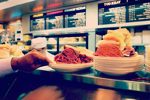 restaurant two hearty sandwiches on plate at the counter carnegie deli