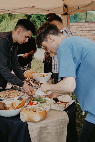 human two men grabbing food person