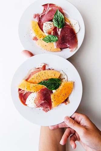 meal two raw meats on white ceramic plates breakfast