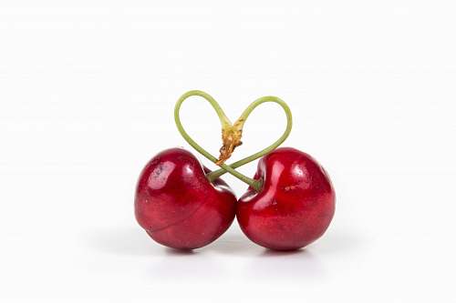 fruit two red cherry fruits on white surface cherry