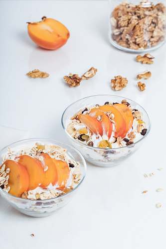 fruit two round glass bowls with food in its breakfast