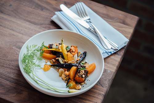 carrots vegetable dish on white plate meal