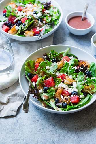healthy vegetable salad on white ceramic bowl salad