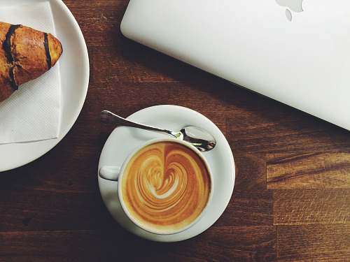coffee white ceramic espresso cup with saucer and spoon with heart form cup