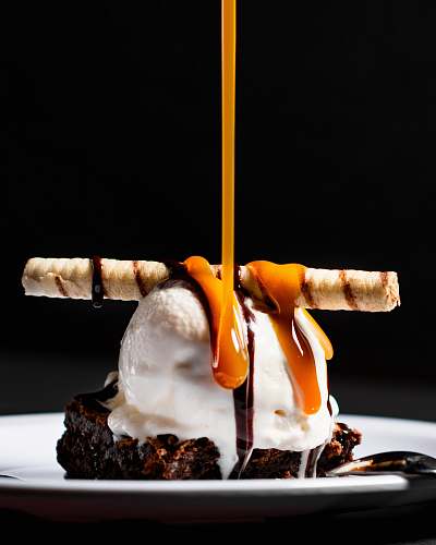 dessert white ice cream on brown cookie chocolate