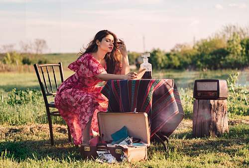 meal woman sitting at table holding wine glass vacation
