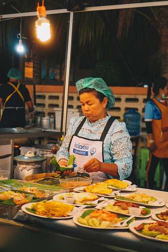 meal woman standing near food human