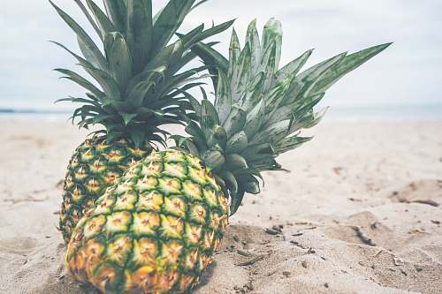 food two yellow pineapples beach