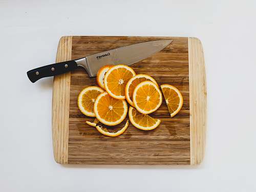 weaponry sliced oranges on chopping board weapon