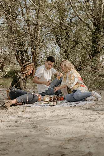 human people doing picnic during daytime person