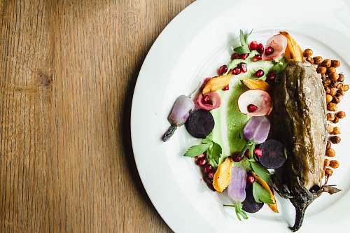 food brown eggplant on round white plate meal