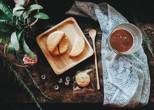 food flat-lay photography of pastry on tray beside glass mug breakfast