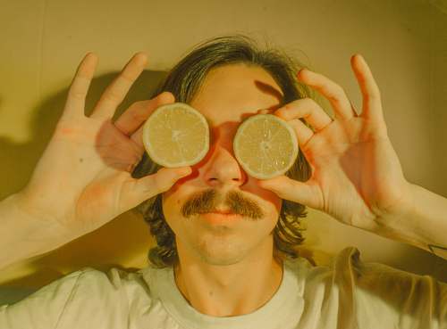 fruit person holding lemon citrus fruit