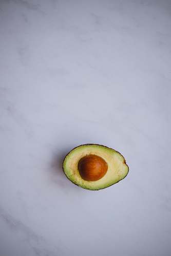 food photo of avocado on white surface avocado