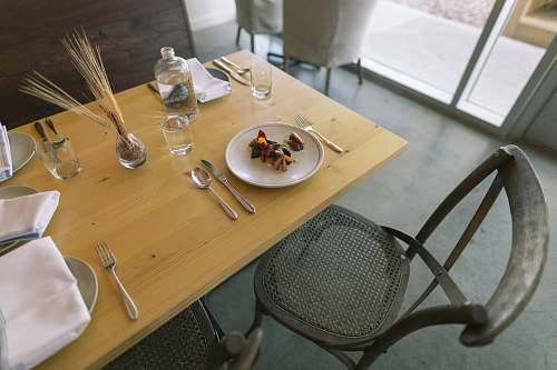 cutlery white ceramic plate and silver flatware on table furniture