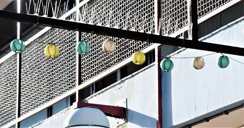 clothing assorted-color Chinese lanterns near building during daytime building