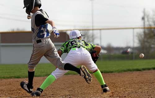 clothing boy about to catch the baseball while the boy runs human