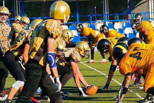 clothing football players at field helmet