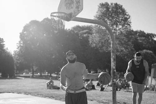 clothing grayscale photography of two men playing basketball black-and-white