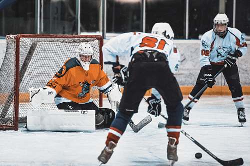 clothing group of men playing ice hockey helmet