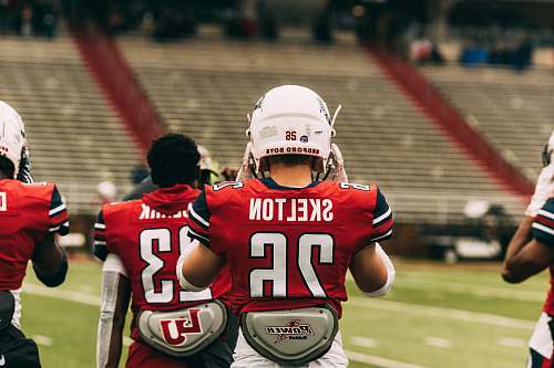 clothing group of player on field helmet