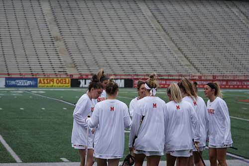 human group of woman standing in lacrosse field person
