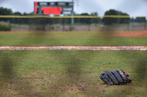 clothing leather baseball mitt on ground sport