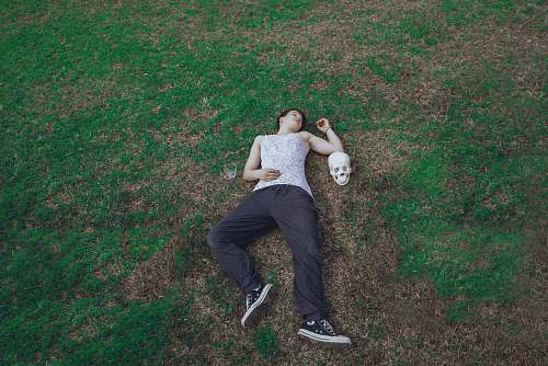 clothing man lying on ground footwear