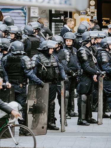 clothing police men wearing helmets helmet