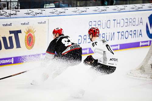 clothing two hockey players in hockey stadium helmet
