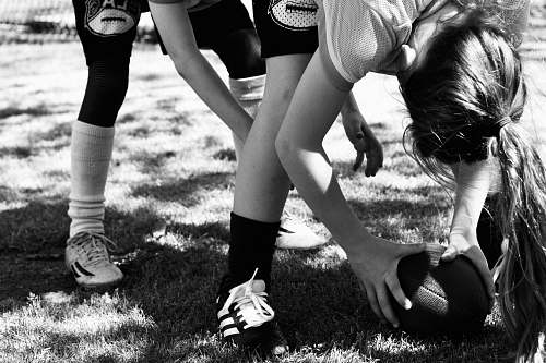 clothing two person playing American football black-and-white