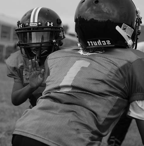 black-and-white two persons playing American football clothing