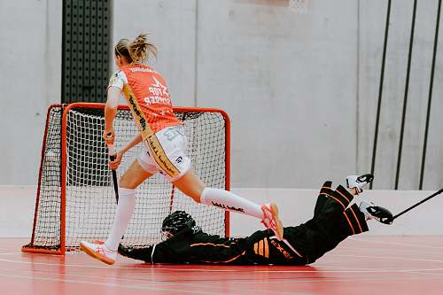 clothing unknown persons playing hockey sphere