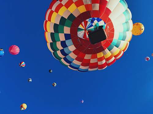 sphere low angle photography of balloons ball
