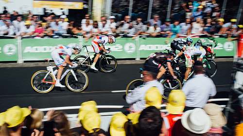 bike group of people watching cyclist racing sport
