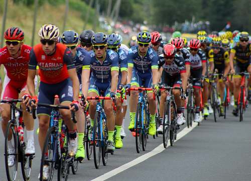 bike people riding on road bikes during daytime cyclist
