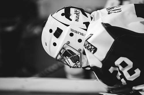 finger grayscale photo of ice hockey player planet ice