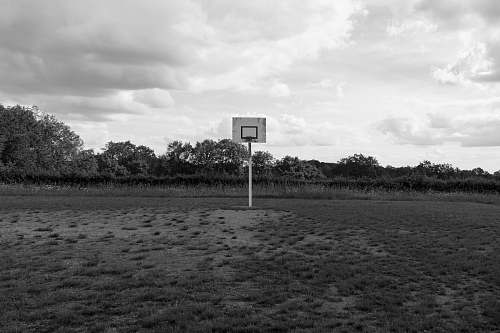france grayscale photography of basketball court outdoors