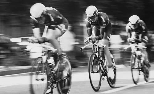 bicycle time lapse photography of three men cycling cyclist