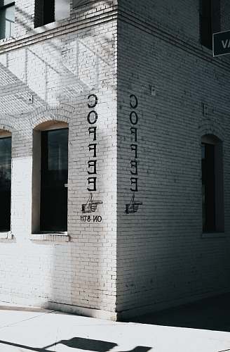 coffee white concrete brick building at daytime grey