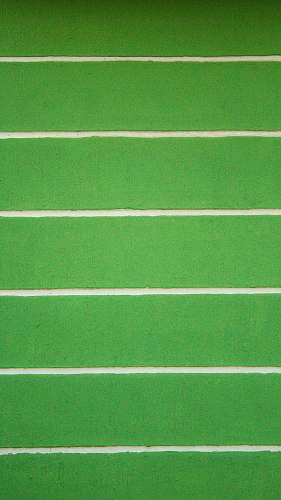 green green and white striped wall football