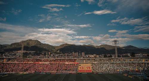 arena green mountains at daytime stadium