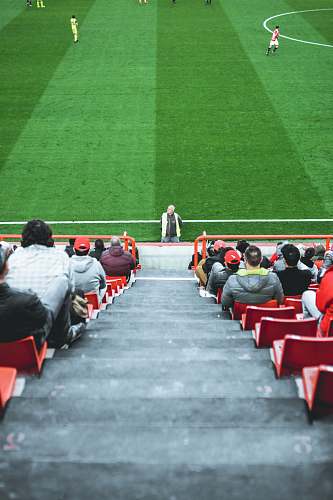 human people sitting on arena bench person