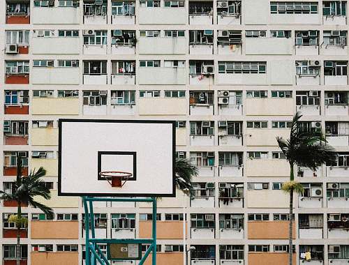 city photo of white and black basketball hoops high rise