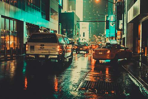 street white car on wet asphalt road urban
